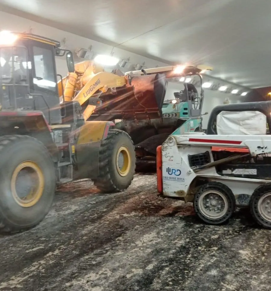 Loaders preparing the formation inside an underpass, night shift