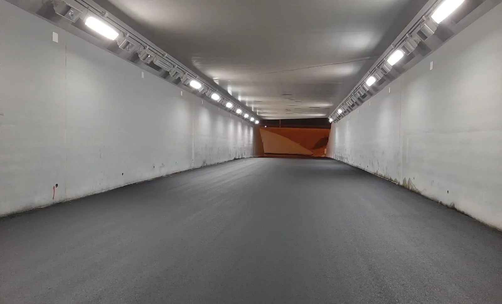 Underpass asphalt surfacing — New Orbital Highway corridor