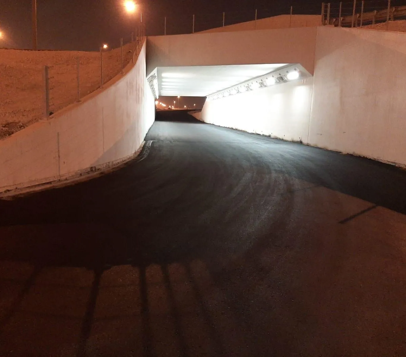Underpass approach — wearing course laid and compacted
